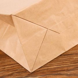 Напечатанная таможней веревочка руки бумажных мешков Крафт экологически дружелюбная плоская поставщик